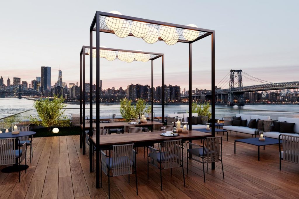 Roof Deck with Ample Seating including Dining Tables, Wood Flooring, Views of Williamsburg Bridge, Waterfront and Cityscape