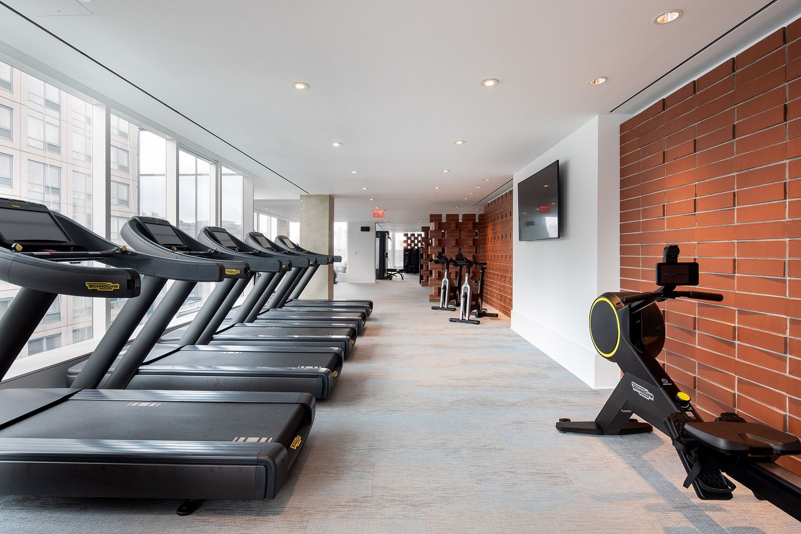 420 Kent Fitness Center with windows and high end workout machines and treadmills